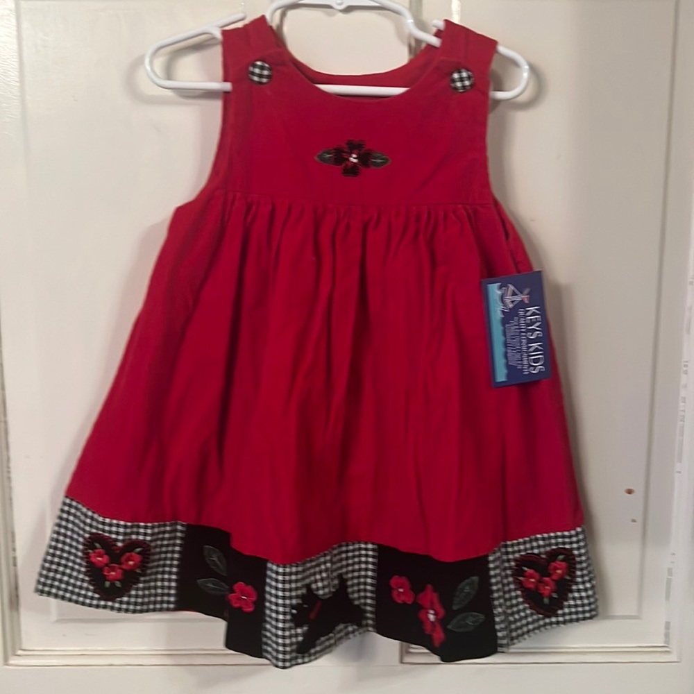 Cute red corduroy girls jumper w black white checked bottoms trim